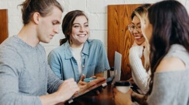 Co-workers collaborating around a table