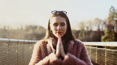 woman in brown fur coat wearing black framed eyeglasses