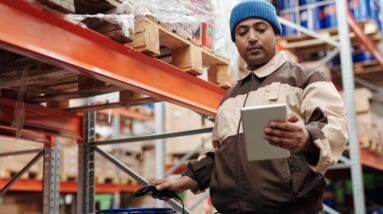 Hardware store employee scanning an item