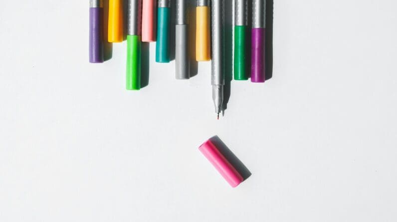 assorted-color on pens on white background