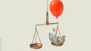 effective upselling - red balloon with scale leaning toward more money